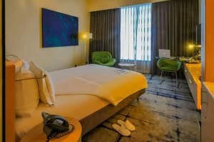 Ένα ή περισσότερα κρεβάτια σε δωμάτιο στο Hotel Rakesh