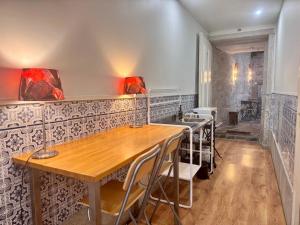 a dining room with a table and a sink at Casa da Maria Reguila in Porto +32 photos