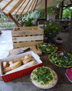a table that has some food on it at Eco-Camping De Helleborus, Yurt, Bell & Safari tent, Pipo, Caravans, Dorms and Units in Groningen