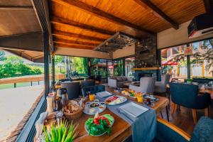 a restaurant with a table with food on it at antik river house in Sile