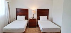 Postel nebo postele na pokoji v ubytování Hotel Suites Mar Elena