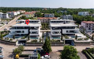 an apartment building with a red marker on it at Lovely Apartment In Malinska With Wifi in Malinska +18 photos