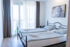 Posteľ alebo postele v izbe v ubytovaní Seaforth Apartment