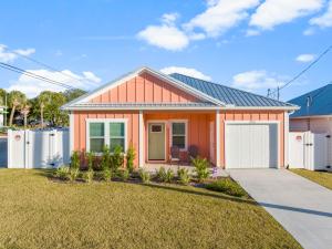 a small orange house with a garage at Laguna Peach: 3BA 2BA retreat for 10! Explore nearby beaches & activities in Laguna Beach