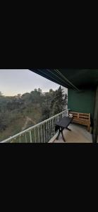 a view of a balcony with a bench and a railing at Chambre chez nous! Au calme, Montolivet proche métro in Marseille