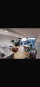 a living room with a couch and a table at Chambre chez nous! Au calme, Montolivet proche métro in Marseille