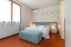 A bed or beds in a room at Villa Selva
