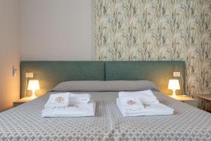 A bed or beds in a room at Villa Selva