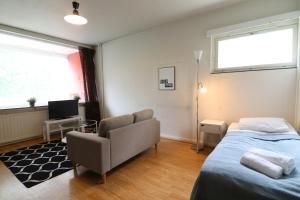 Ένα ή περισσότερα κρεβάτια σε δωμάτιο στο Convenient Apartment for 2