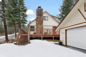 a house with a deck and a chimney at Swiss delight #2244 in Big Bear Lake