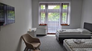 Ліжко або ліжка в номері Hotel Radnice Dobrovice