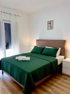 Ένα ή περισσότερα κρεβάτια σε δωμάτιο στο Teo apartmani