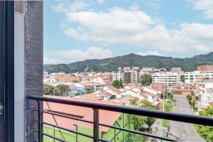 a view of a city from a balcony at Loft Home Suites 118 By gA in Bogotá