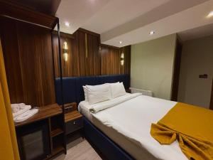 Ein Bett oder Betten in einem Zimmer der Unterkunft Galata Calm Tale Hotel