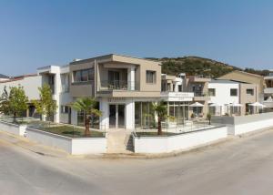 an apartment building on the side of a street at Thines Comfort Living in Néa Péramos