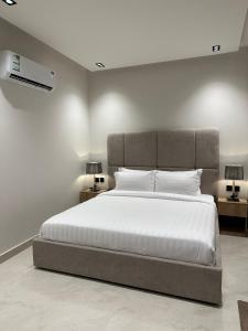 Ένα ή περισσότερα κρεβάτια σε δωμάτιο στο dana hotel apartments