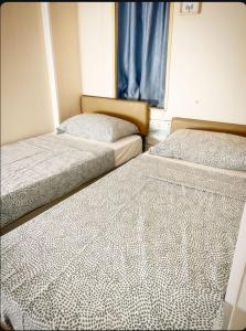 Letto o letti in una camera di The Cultural Crashpad - 康乃馨旅館