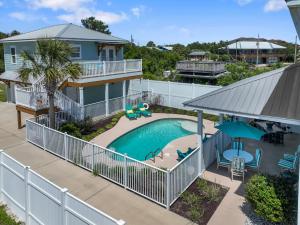 an aerial view of a house with a swimming pool at 5 Bed, 5 Bath Beach Home/Only a 3 Minute Walk To The Beach! SLEEPS 12 in Sunnyside