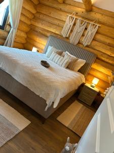 an overhead view of a bed in a room at Sub Stele Chalets in Holbav