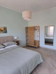 Ένα ή περισσότερα κρεβάτια σε δωμάτιο στο Villino Partenope