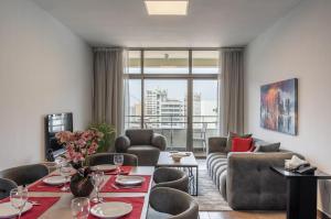 a living room with a couch and a table at Santona Residence in Beirut