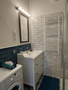 Koupelna v ubytování K15 Cozy Apartment + 7 fotografií