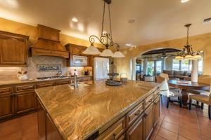 a kitchen with a large marble counter top at Paso Palacio in Paso Robles