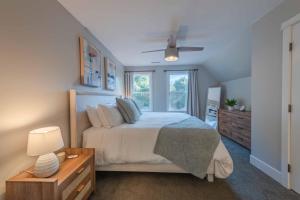 a bedroom with a bed and a window at Sycamore Ranch in Templeton +85 photos