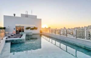 a pool on the roof of a building at JP Redenção by LikeHome in Porto Alegre