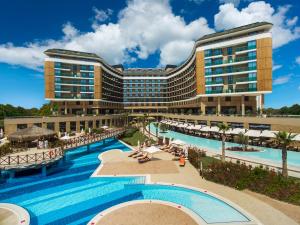 a hotel with a swimming pool and a resort at Aska Lara Resort & Spa Hotel in Lara