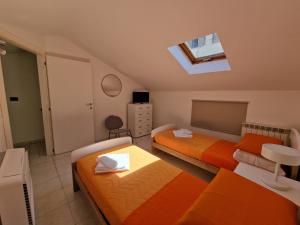 Letto o letti in una camera di La Terrazza HOUSE