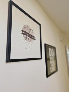 Certificato, attestato, insegna o altro documento esposto da La Terrazza HOUSE