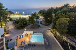 an overhead view of a building with a swimming pool at Beachfront penthouse Residence in Podstrana