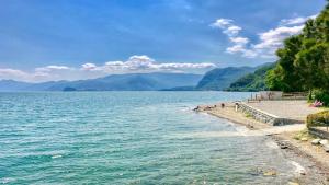 a view of a body of water with mountains at Blue Lake in Acquaseria