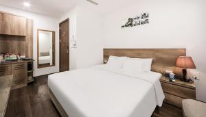 Postel nebo postele na pokoji v ubytování A25 Hotel - Hoàng Đạo Thúy 1
