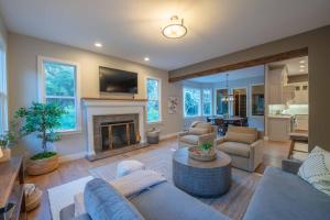 a living room with a couch and a fireplace at Sycamore Ranch in Templeton