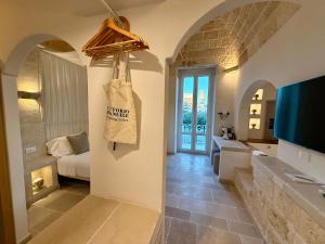 Postel nebo postele na pokoji v ubytování Vittorio Emanuele Charming Suites
