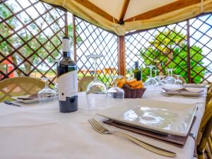 a bottle of wine sitting on top of a table at Villa Barbarina - Nature Resort with Pool & Restaurant - Alghero in Santa Maria la Palma