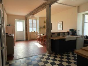 a kitchen with a counter and a dining room at Maison de Famille avec Jardin - Coeur du village - Zoo de Beauval in Saint-Aignan +12 photos