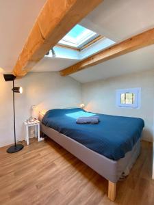 Katil atau katil-katil dalam bilik di Triplex Les Pieds Dans L'Eau Cap Camarat