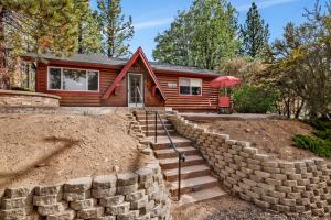 a home with a retaining wall and a house at Moulin rouge #2055 in Big Bear Lake