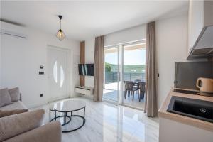 a living room with a couch and a table at Villa Kristina in Neum