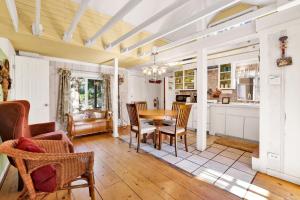 a kitchen and dining room with a table and chairs at Pines 23 #1438 in Big Bear Lake