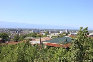 a view of a city from the top of a hill at Sun-Kissed House in Kutaisi