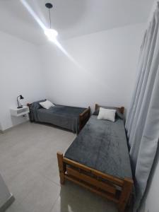 Postel nebo postele na pokoji v ubytování Magnolia Duplex