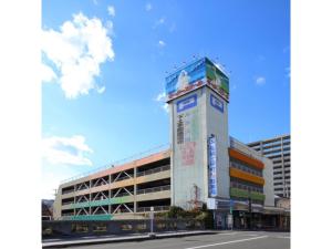 a building with a sign on the side of it at Smile Hotel Hirosaki - Vacation STAY 40505v in Hirosaki +14 photos