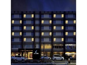 a building with cars parked in front of it at Quad Inn Yokote - Vacation STAY 59873v in Yokote