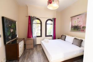 A bed or beds in a room at MARASSI VERONA VILLA by ELEGANT Hospitality