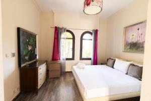 A bed or beds in a room at MARASSI VERONA VILLA by ELEGANT Hospitality