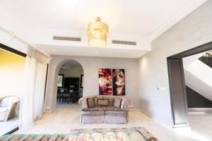 A seating area at MARASSI VERONA VILLA by ELEGANT Hospitality
